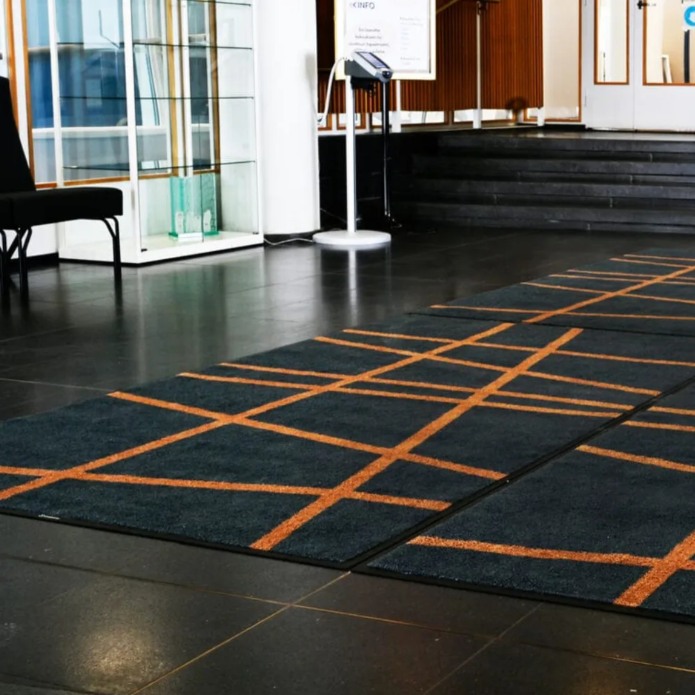 Custom office floor mats designed to keep modern hallways clean and safe.