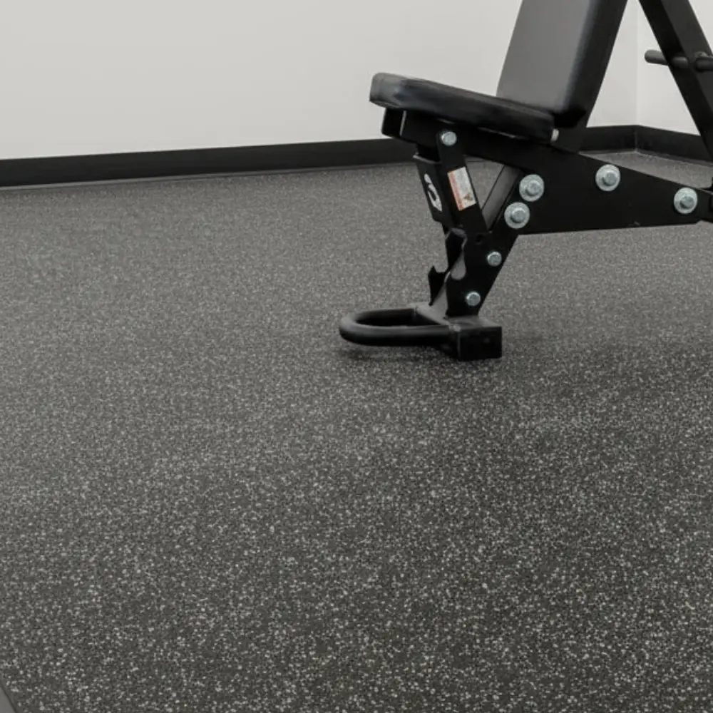 Heavy-duty Rubber Flooring providing a textured, non-slip surface in a modern fitness center.