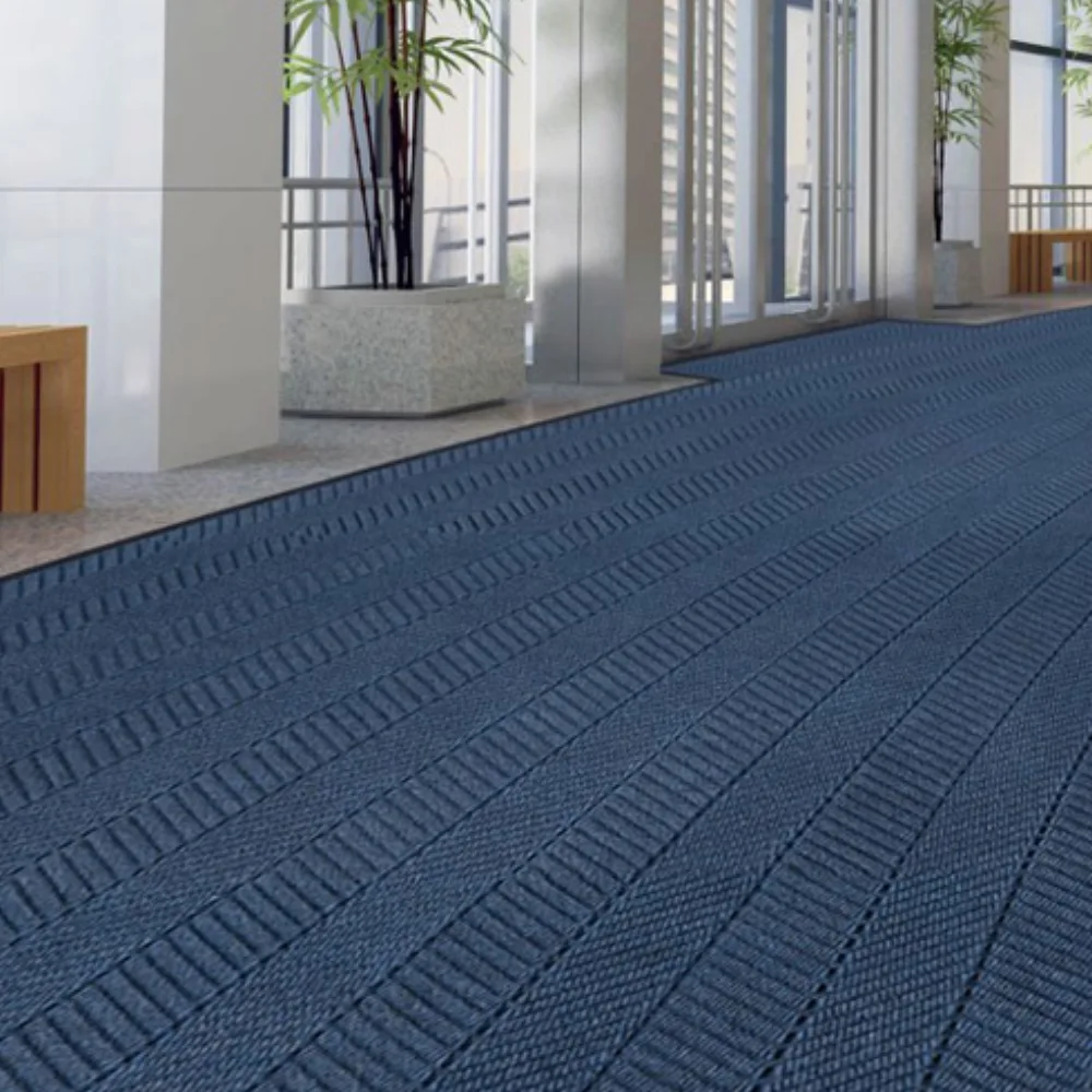 Heavy-duty Waterhog mats placed on a rainy day to prevent slips in a busy office lobby