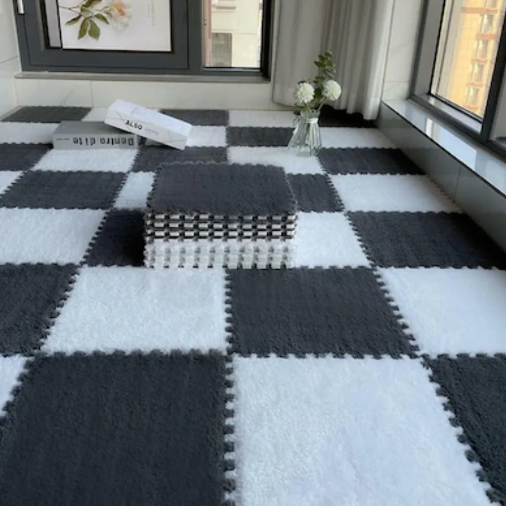 Interlocking black and white Foam Mats with a plush carpet surface in a checkered pattern.