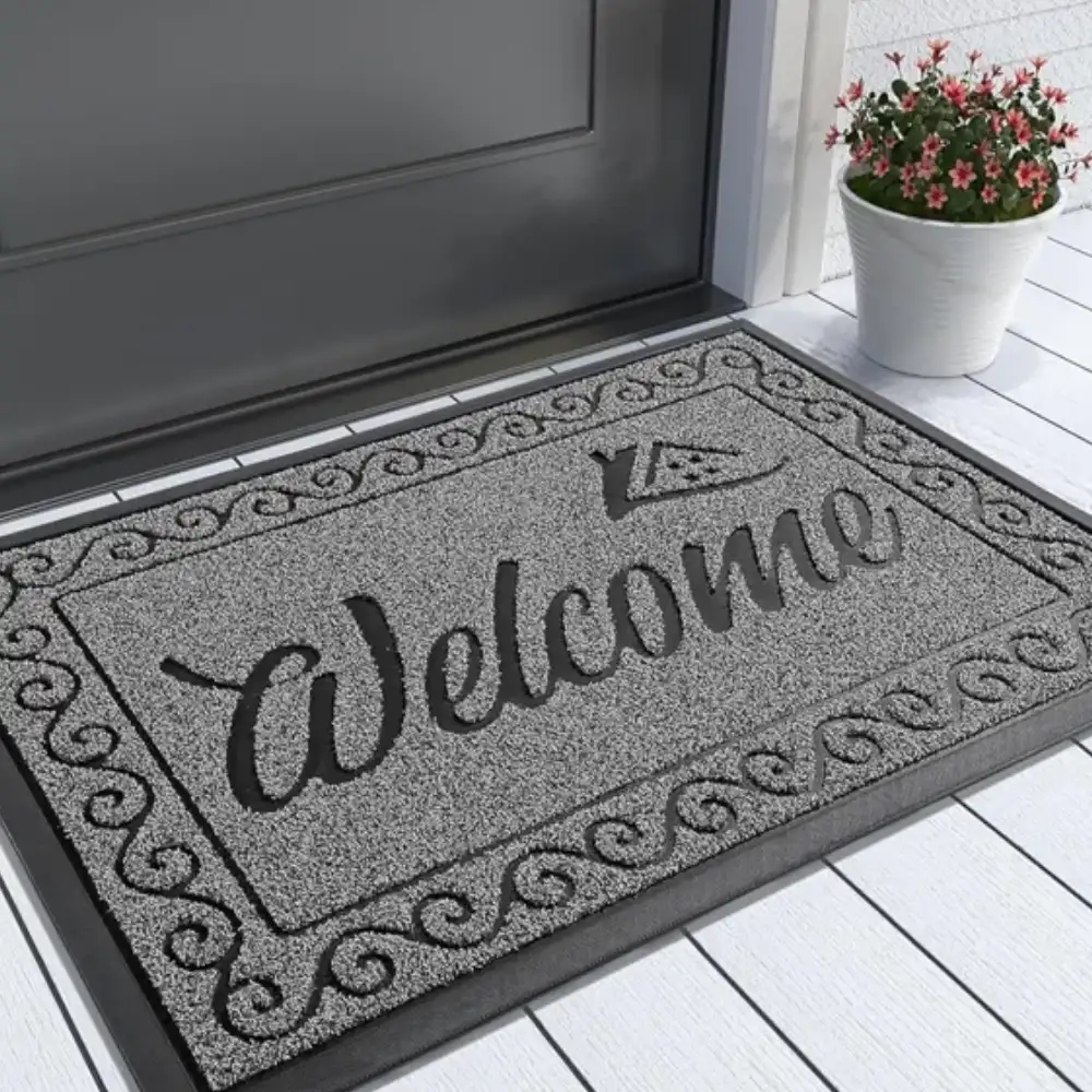 Minimalist black Welcome mats on a porch, creating a clean and inviting entryway.