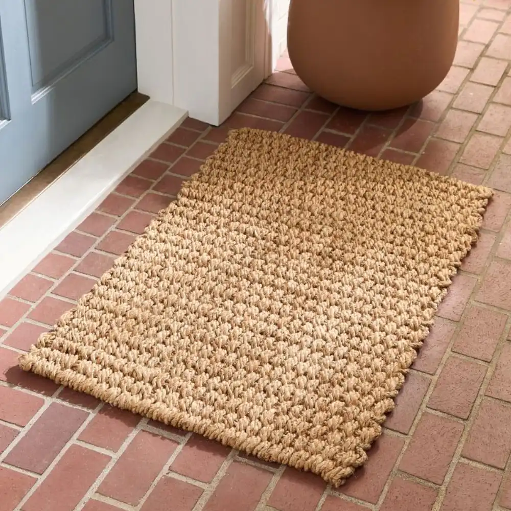 Rectangle floor jute Mats placed at a home entrance for a clean and organic look.