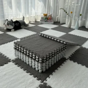 Two pieces of gray Eva Foam Mats being connected together by their puzzle-shaped edges.