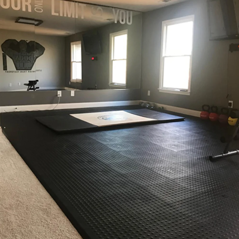 Cushioned support & comfort mats covering a gym floor for joint support and comfort.