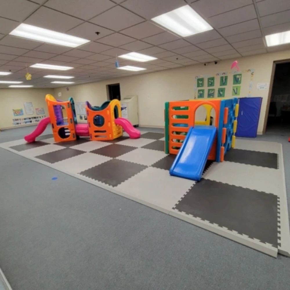 Impact-absorbing kids play area flooring ideal for schools, parks and daycare centers.