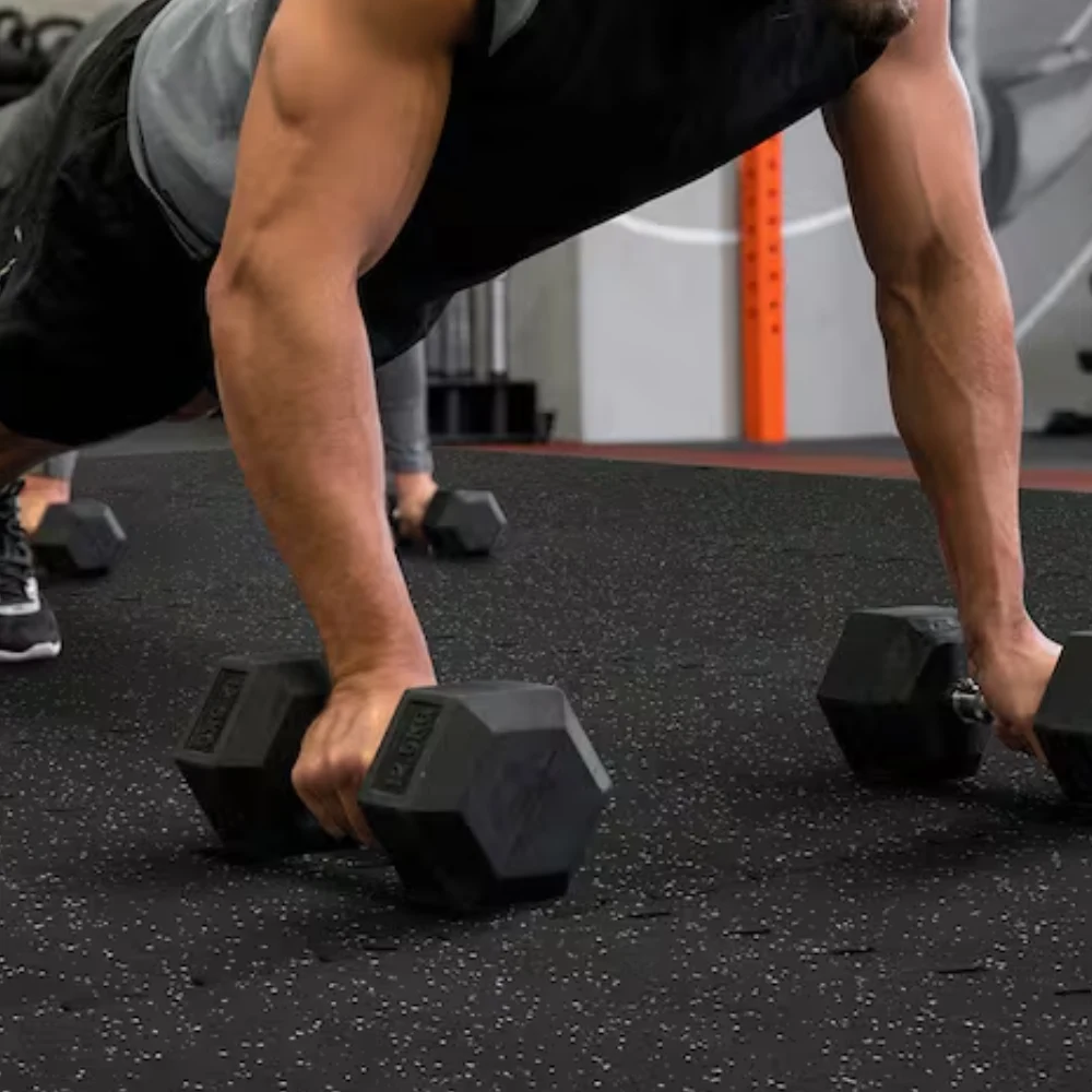 Non-slip workout mats providing a stable surface for intense weight training.