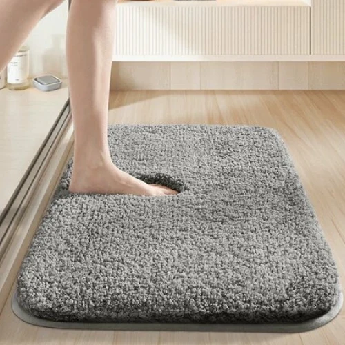 Puffin bath mat with soft absorbent surface and anti-slip backing for safe bathroom flooring.
