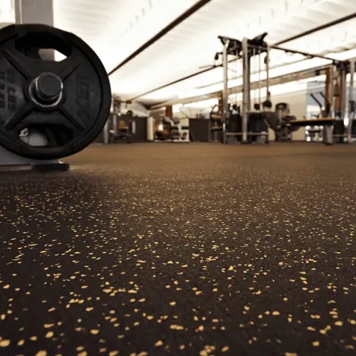Black rubber flooring with EPDM speckles in a professional workout area