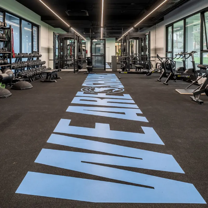 Recently installed custom logo gym flooring in Dubai featuring durable rubber flooring, shock absorption, strong traction and a professional fitness area finish.